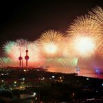 Colorful fireworks illuminate Kuwait Towers, celebrating a night of joy and festivities.
